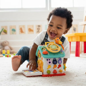 Toddler playing with colorful Montessori Busy House toy for fine motor skills development on playroom floor