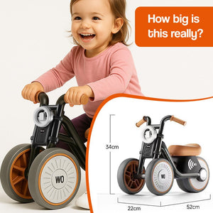 Toddler riding Tiny Biker Anti-Tip Light & Sound Motorcycle with three wheels and comfortable seat, child toy for ages 1-6