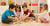 Children playing together with educational wooden blocks on the floor in a bright, organized playroom.