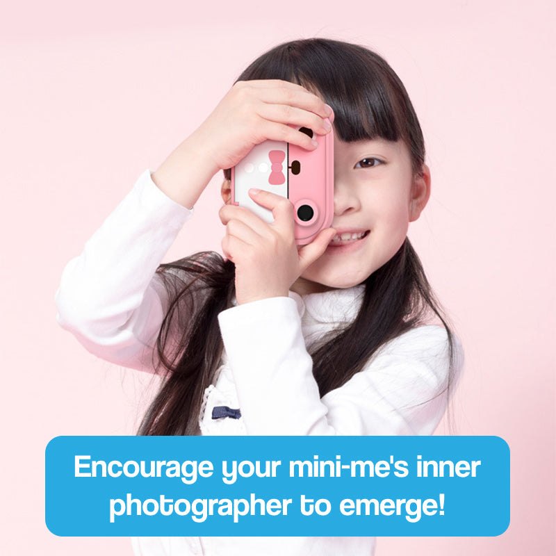 Child using pink Kid Instant Print Camera with cute design on light pink background