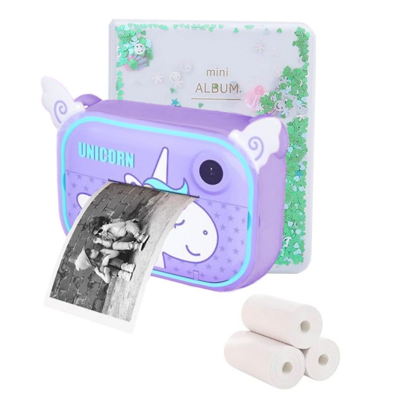 Kids instant print camera with unicorn design, prints black and white photos on thermal paper, includes mini album and paper rolls