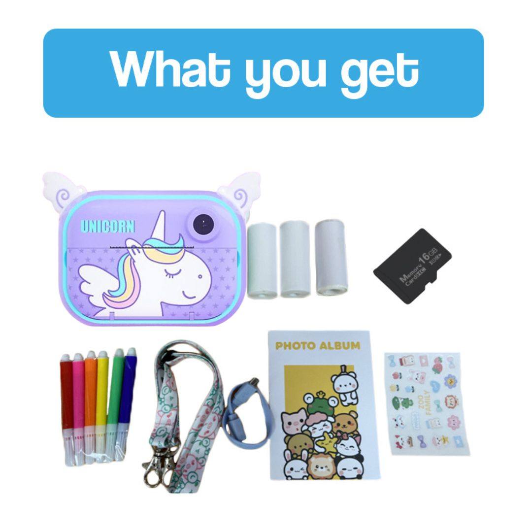 Kid instant print camera Halloween edition with unicorn design, thermal paper rolls, colored markers, 16GB memory card, stickers, lanyard, and photo album kit