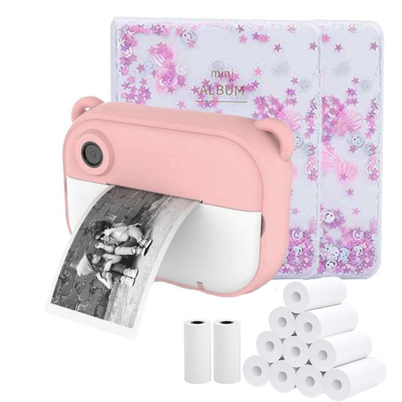 Pink kid instant print camera with black and white photo printing, thermal paper rolls, and mini photo albums in Halloween theme
