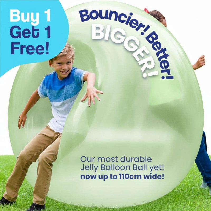 Kids playing with giant green inflatable Jelly Balloon Ball outdoors, promoting active fun and cooperative play.